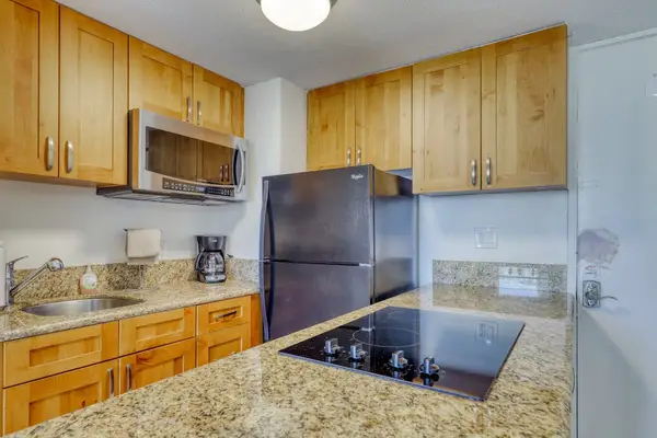 Fully equipped kitchen with granite countertops, full-size appliances, coffee maker, and everything needed for home-cooked meals.