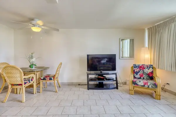 Relax with your favorite shows in the bright living room featuring a smart TV and comfortable seating.