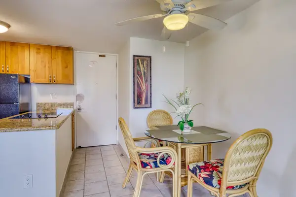Open-concept dining space connects seamlessly to the fully equipped kitchen for added convenience.