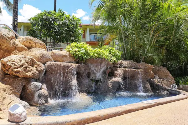 Cool off, relax, and soak up the sun in the inviting shared pool area.