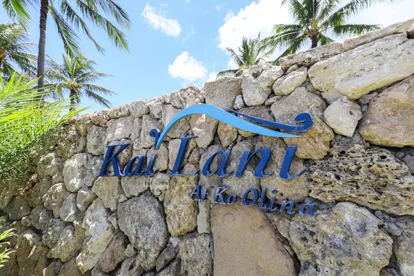 A welcoming sign by the front gate marks the entrance and adds a personal touch to the property.