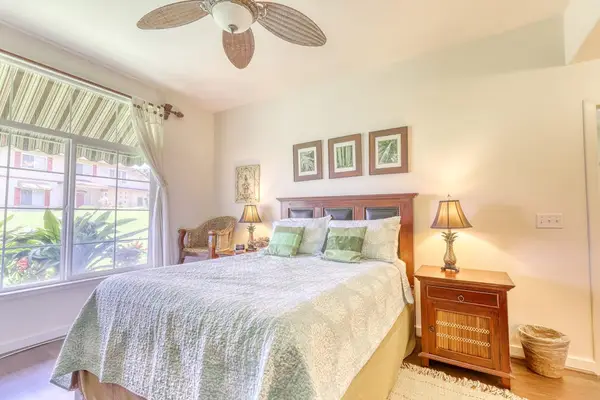 Relax and unwind in a comfortable master bedroom featuring a queen-size bed for a restful stay.