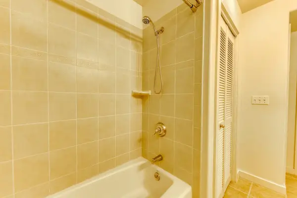 Enjoy the convenience of a bathtub and shower combination designed for a comfortable stay.