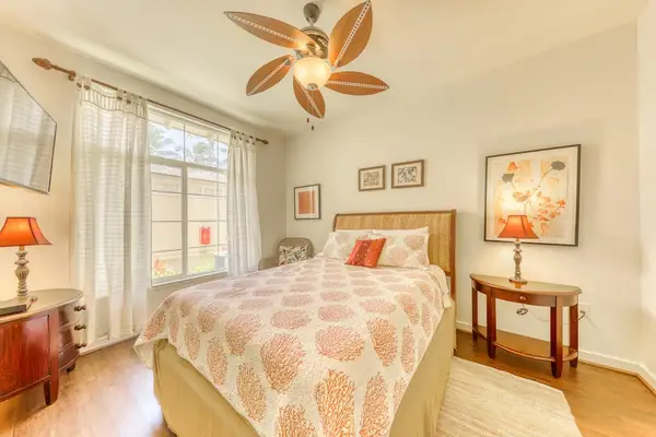 Enjoy a relaxing stay in this inviting bedroom with a comfortable queen-size bed.
