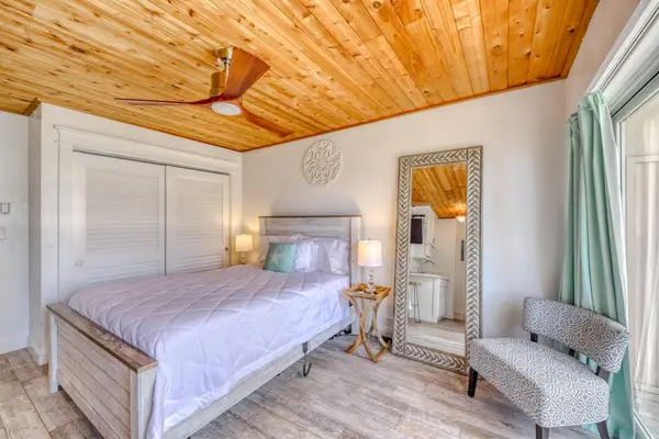 Enjoy a cozy studio retreat with a comfortable queen bed and convenient TV access.