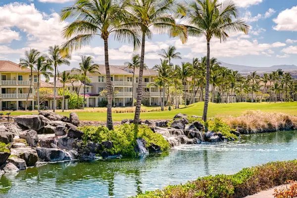Lush resort grounds feature Green resort lawn provides palm-lined space for peaceful outdoor enjoymentFirst bedroom features ceiling fan comfortable bedding and window lightFirst bedroom features comfortable bedding ceiling fan and natural lightpalm trees lawns and water views