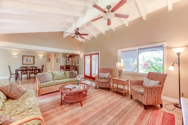 Sunlit Secondary Living Area with Wood-Beamed Ceilings