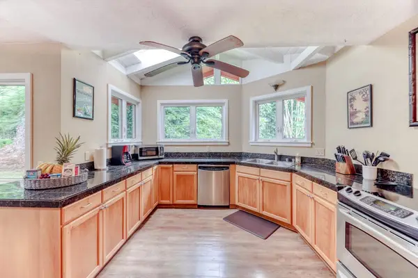 Kitchen Featuring Granite Countertops & Stainless Steel Appliances