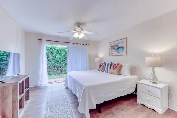 Bright Primary Bedroom with King Bed & Ceiling Fan