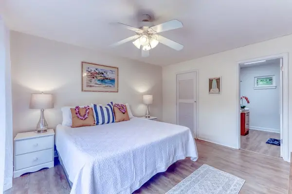 Cozy Primary Bedroom with Matching Nightstands & Ceiling Fan