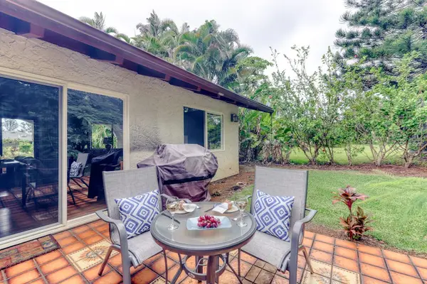 Covered Outdoor Lanai with Seating & Garden Views