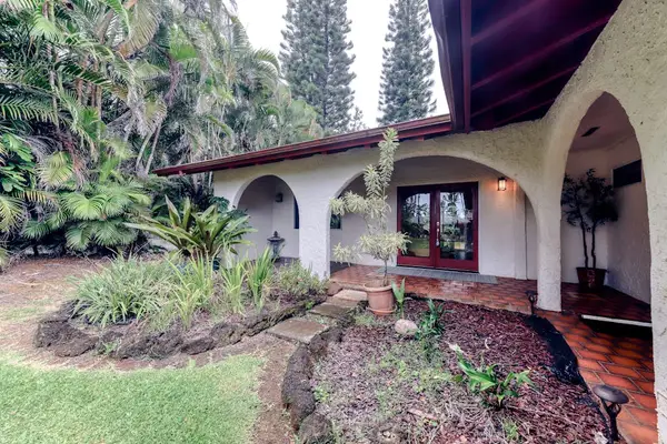 Covered Front Entrance with Tropical Architectural Details