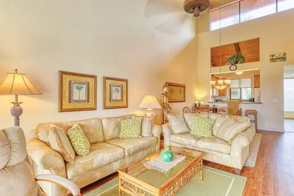 Sink into the plush sofas in our bright, open-concept living area, featuring soaring high ceilings and the perfect setup for family movie night! 🎬✨