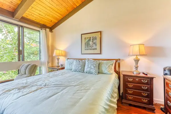 Your perfect escape! Rest easy in this beautifully designed bedroom, complete with cozy reading lighting and a peaceful, nature-filled backdrop. 🌴💤💡