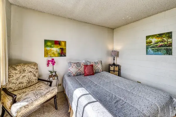 Cozy guest bedroom with reading chair