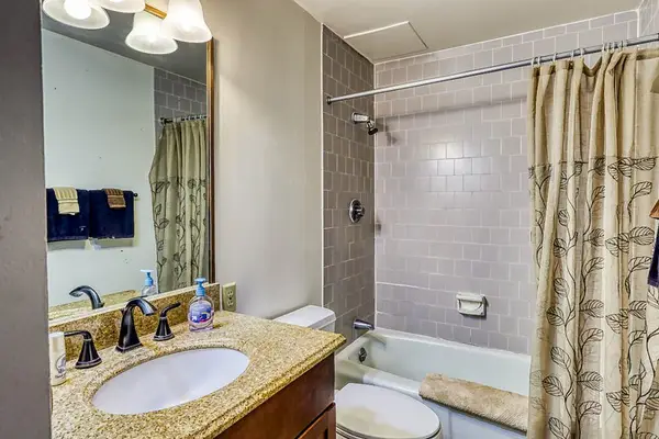Full bathroom with shower and bathtu
