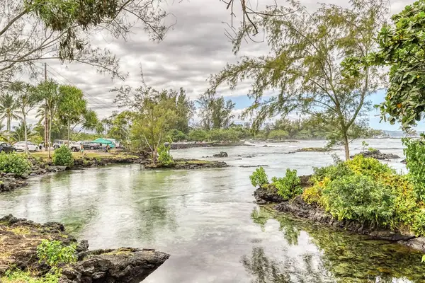 Peaceful waterfront surrounded by tropical scenery