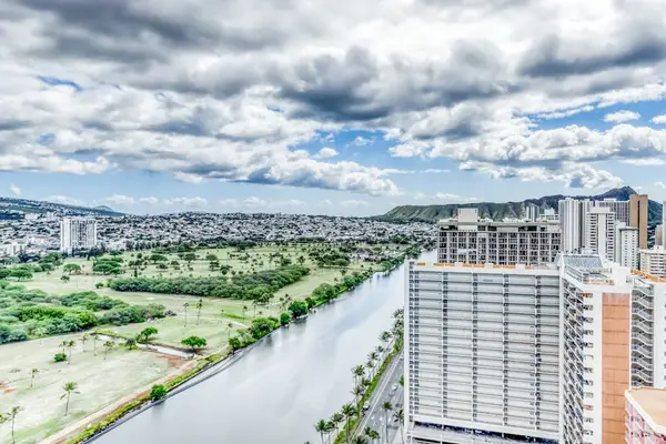 Take in a breathtaking panorama where peaceful canal waters meet dramatic mountain scenery.