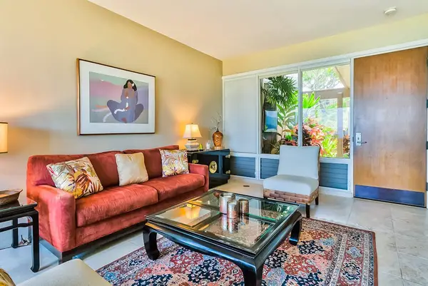 Living room with comfortable seating with floor to ceiling windows for you to take in the amazing views of your tropical paradise.