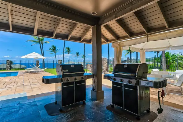 You'll have access to the pool's grill area and tennis court, as well as the beach below - so be sure to bring your provided beach chairs along! Ocean views and a glimpse of nearby island Molokai greet you from this rental.