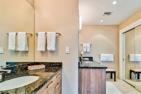 Master bathroom with newly remodeled large walk-shower and double sinks.