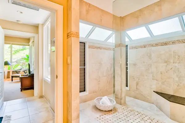 Master bathroom with newly remodeled large walk-shower and double sinks.