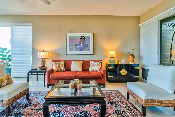 Living room with comfortable seating with floor to ceiling windows for you to take in the amazing views of your tropical paradise.