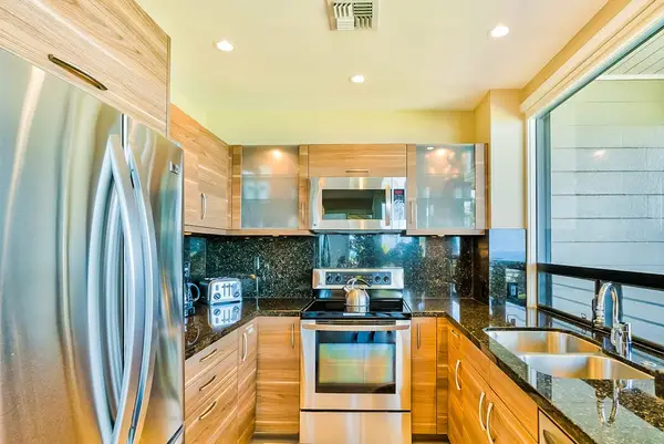 Fabulously remodeled new kitchen with stainless steel appliances and granite countertops.