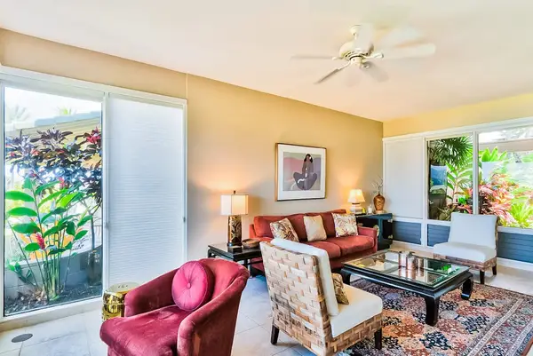 Living room with comfortable seating with floor to ceiling windows for you to take in the amazing views of your tropical paradise.