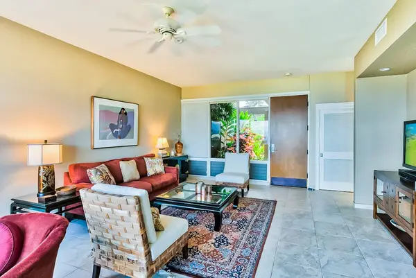 Living room with comfortable seating with floor to ceiling windows for you to take in the amazing views of your tropical paradise.