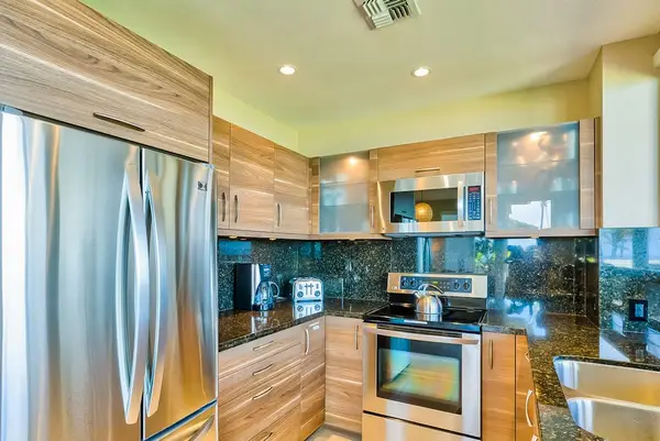 Fabulously remodeled new kitchen with stainless steel appliances and granite countertops.