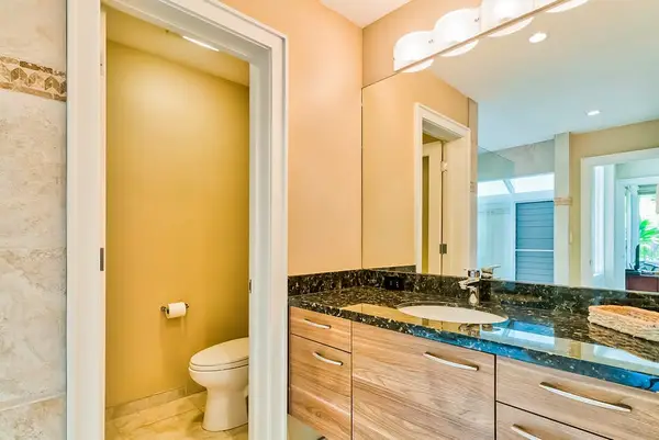Master bathroom with newly remodeled large walk-shower and double sinks.