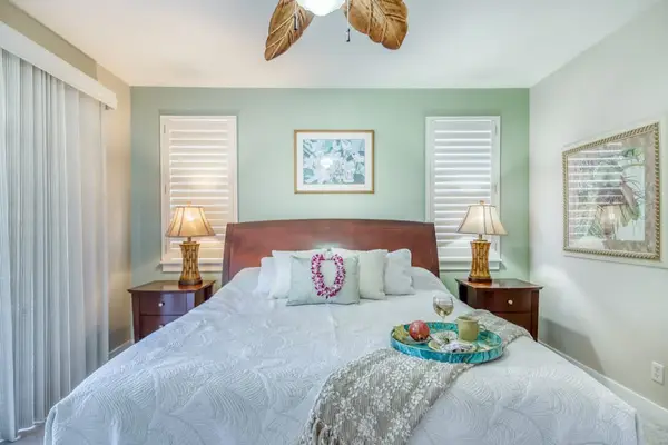 Serene Bedroom Featuring Comfortable King Bed & Natural Light