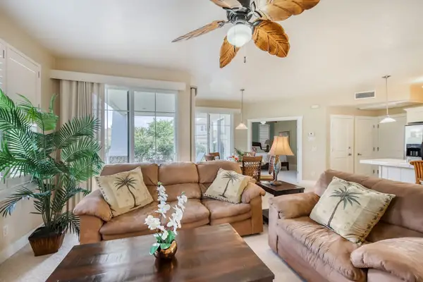 Spacious Tropical Living Area with Coastal Breeze & Ceiling Fan