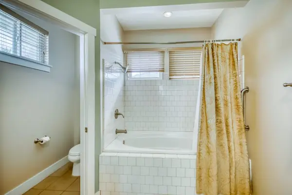 Clean & Bright Guest Bathroom with Shower & Soaking Tub Combo