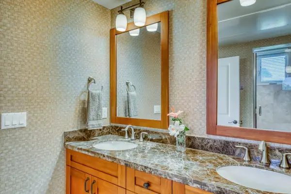 Elegant Primary Bathroom With Granite Vanity