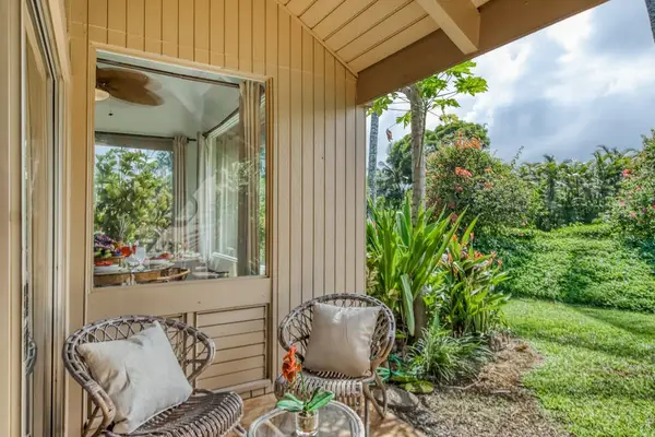 Peaceful lanai overlooking lush tropical gardens