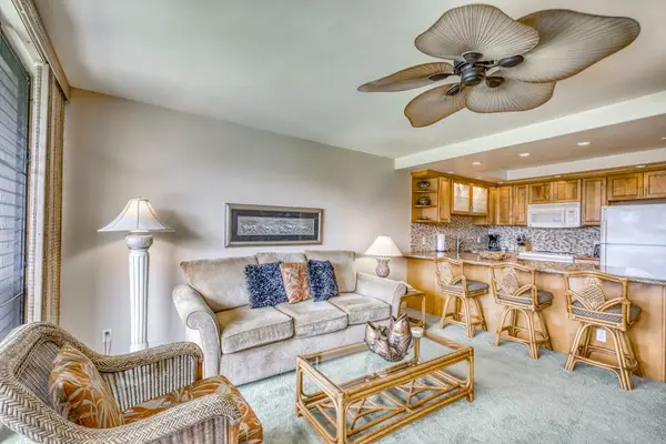 Bright Living Room Filled With Island Comfort