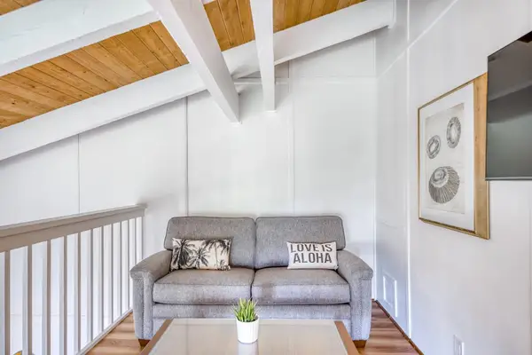 Cozy Loft Seating Area with Vaulted Ceilings & TV