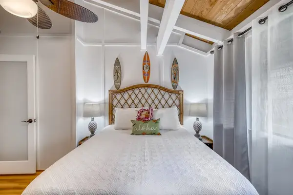Symmetrical View of Guest Bedroom under Vaulted Ceilings