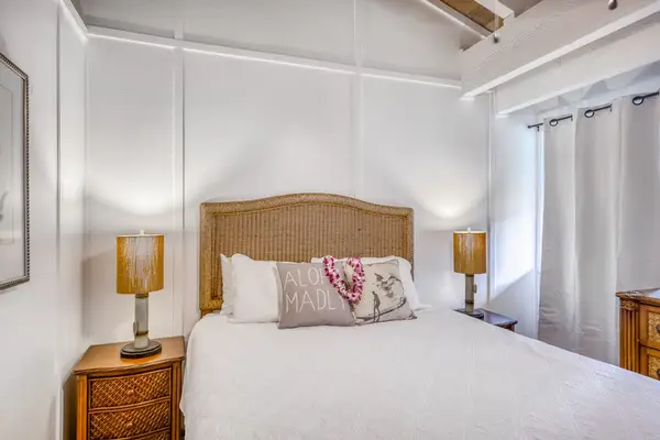 Inviting Seconday Bedroom Suite with Woven Headboard