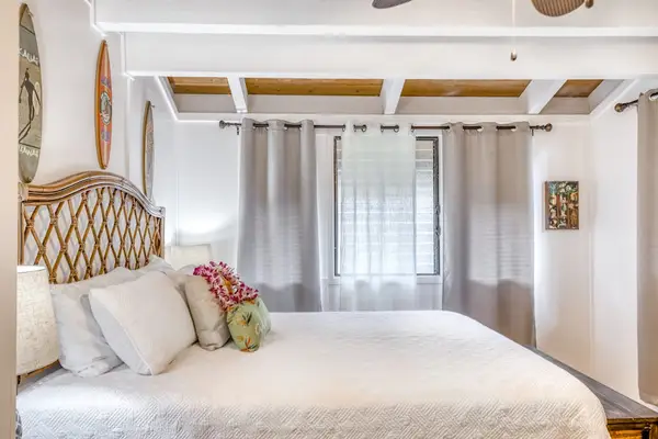 Coastal Guest Bedroom with Surfboard Wall Decor
