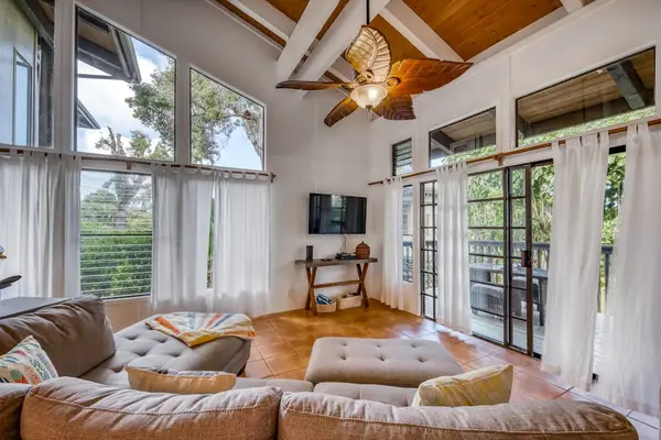 Bright Living Room with Sectional Sofa & Wall TV