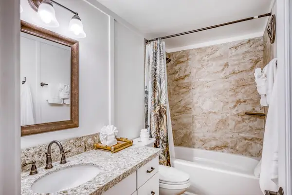 Full Guest Bathroom with Granite Vanity & Soaking Tub