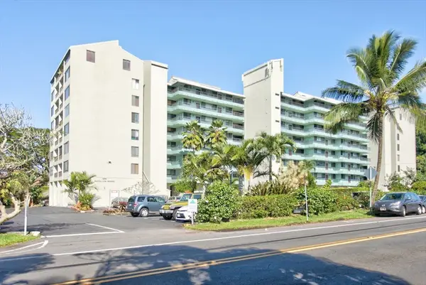 Welcoming Condo Exterior Surrounded By Palms