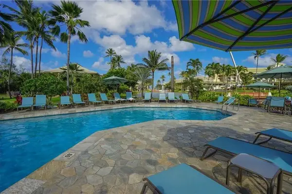 Refreshing Resort Pool With Tropical Garden Views