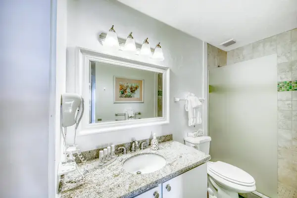 Pristine Modern Bathroom Featuring Custom Tile Design