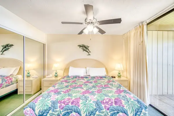 Serene Bedroom Oasis Complete With Mirrored Closets