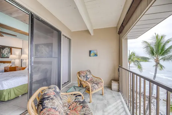 Private lanai with comfortable seating and ocean views.