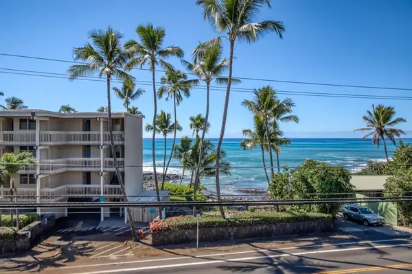 Beautiful resort building exterior featuring tropical palm trees and stunning ocean views! 🌴🌊😎